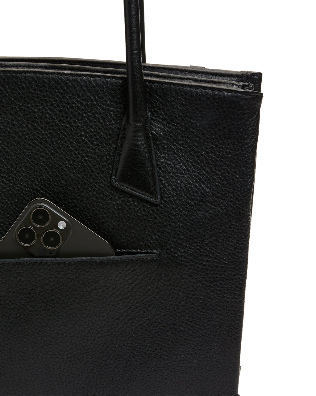 Close-up of the front drop pocket holding a phone