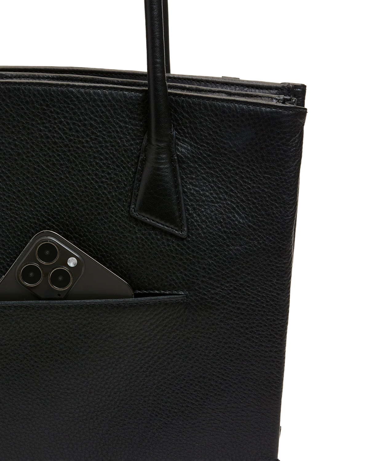Close-up of the front drop pocket holding a phone
