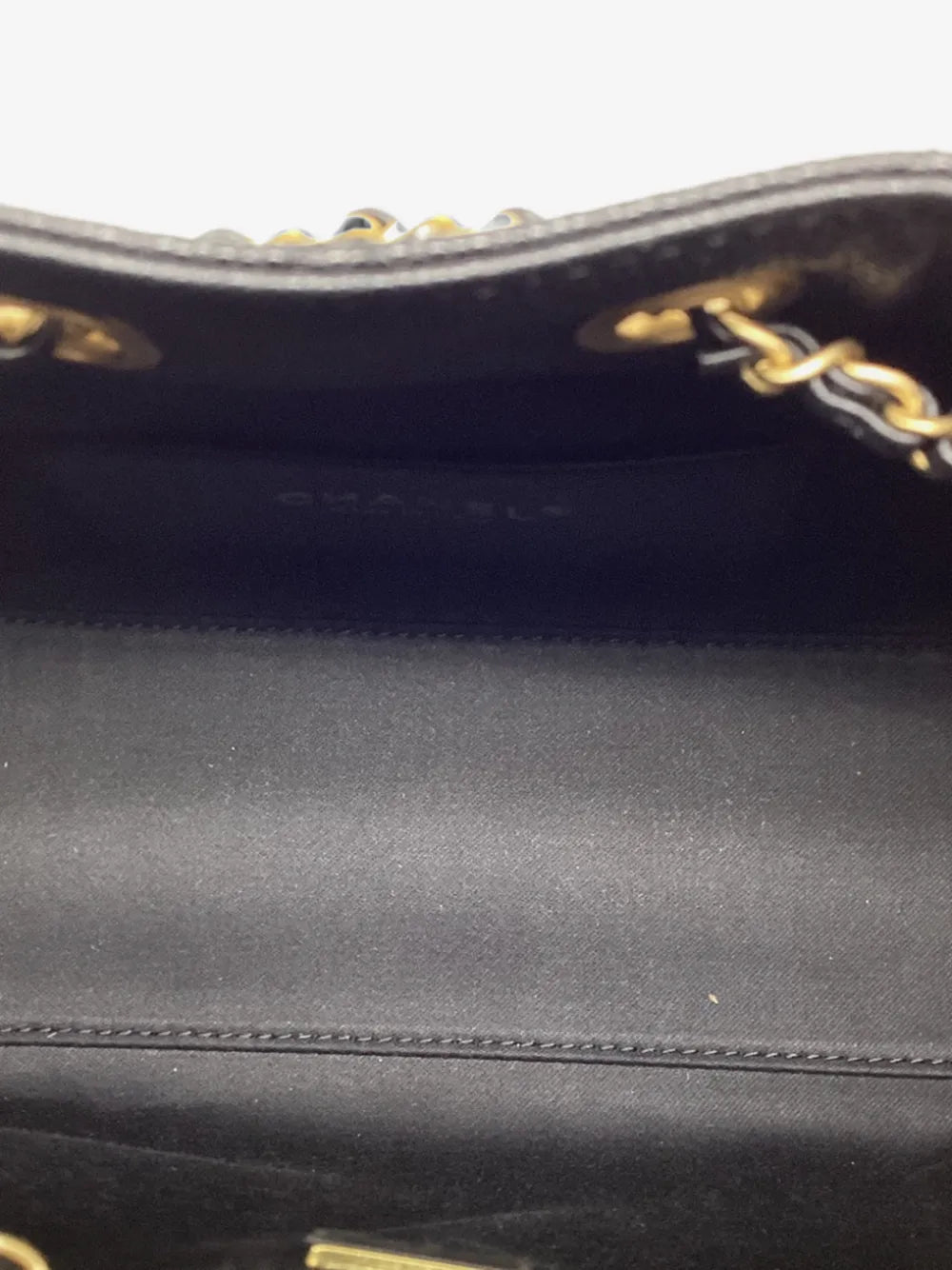 Interior of the Chanel shoulder bag showing the slip pocket