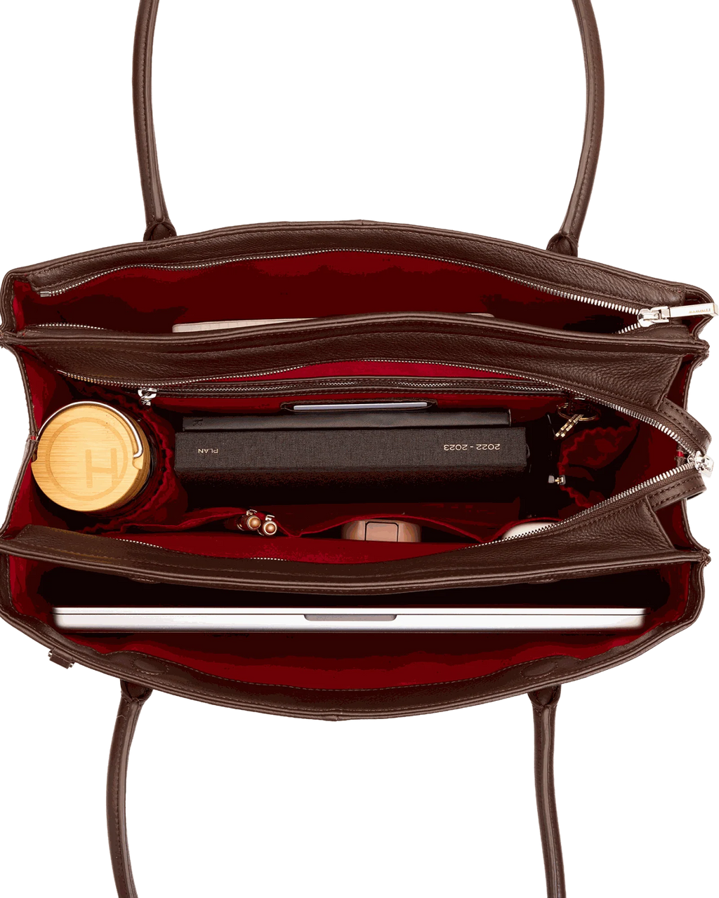 Brown tote interior: red twill lining, laptop compartment and elastic bottle pockets