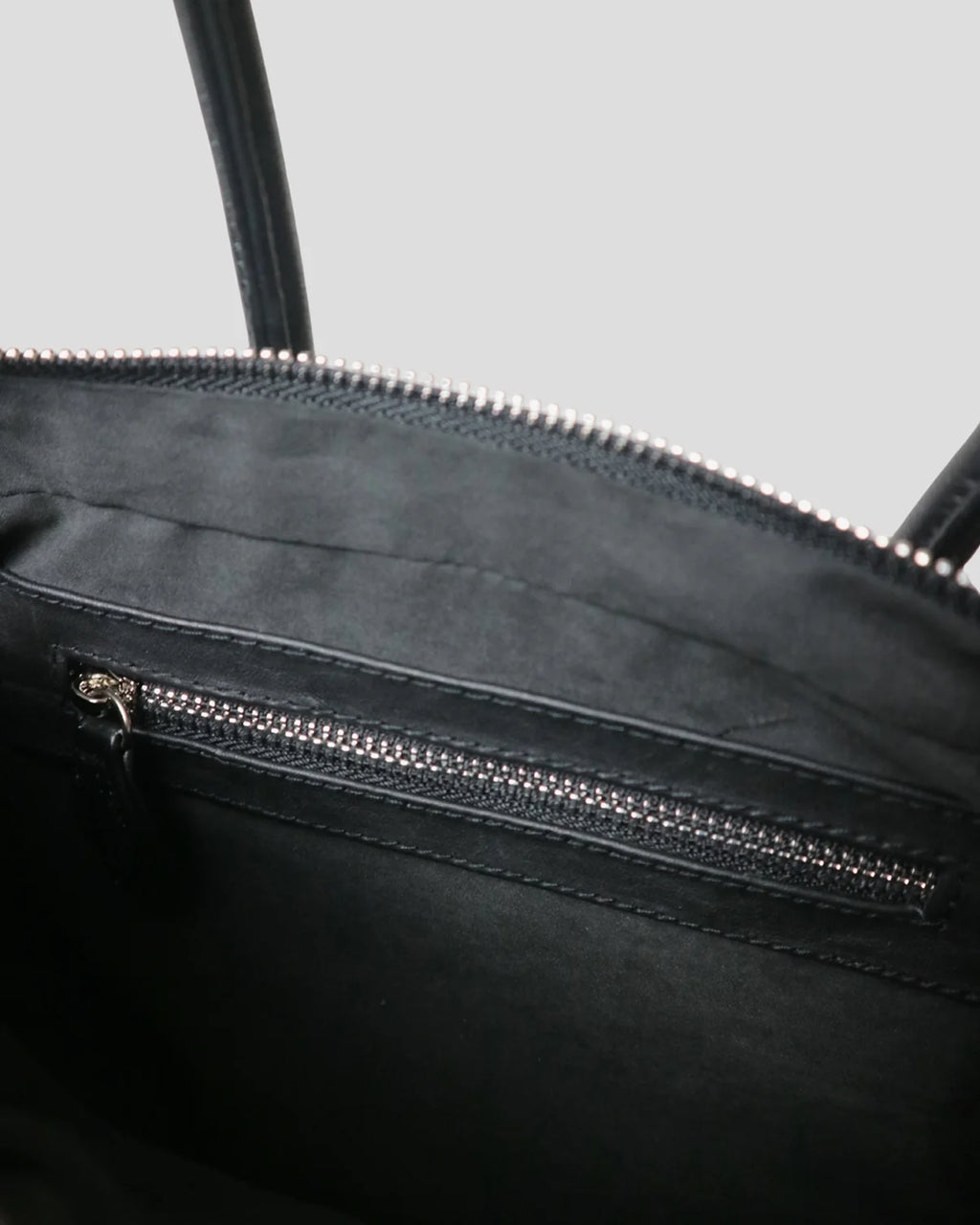 Interior of the Cila bag showing the zipper pocket
