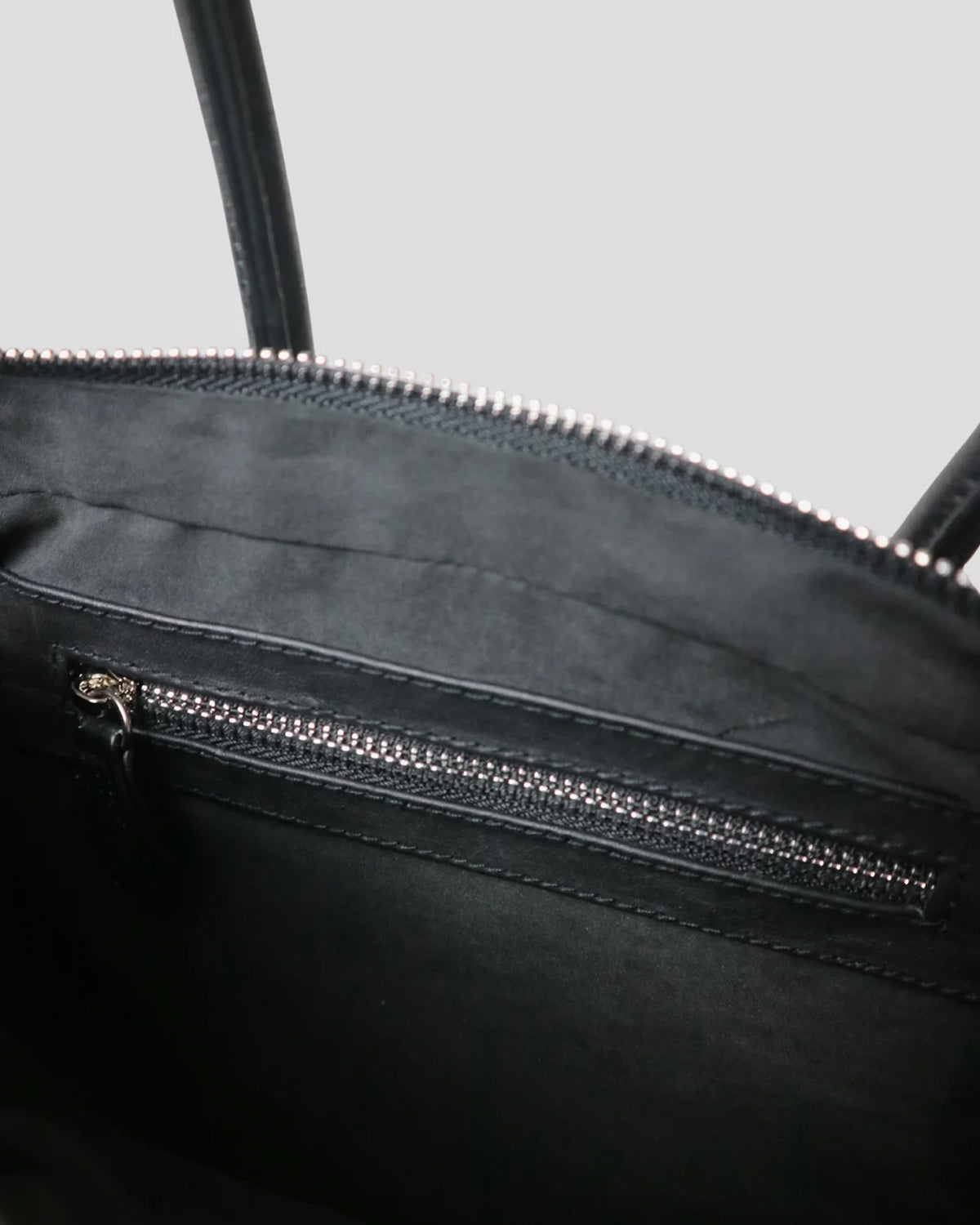 Interior of the Cila bag showing the zipper pocket